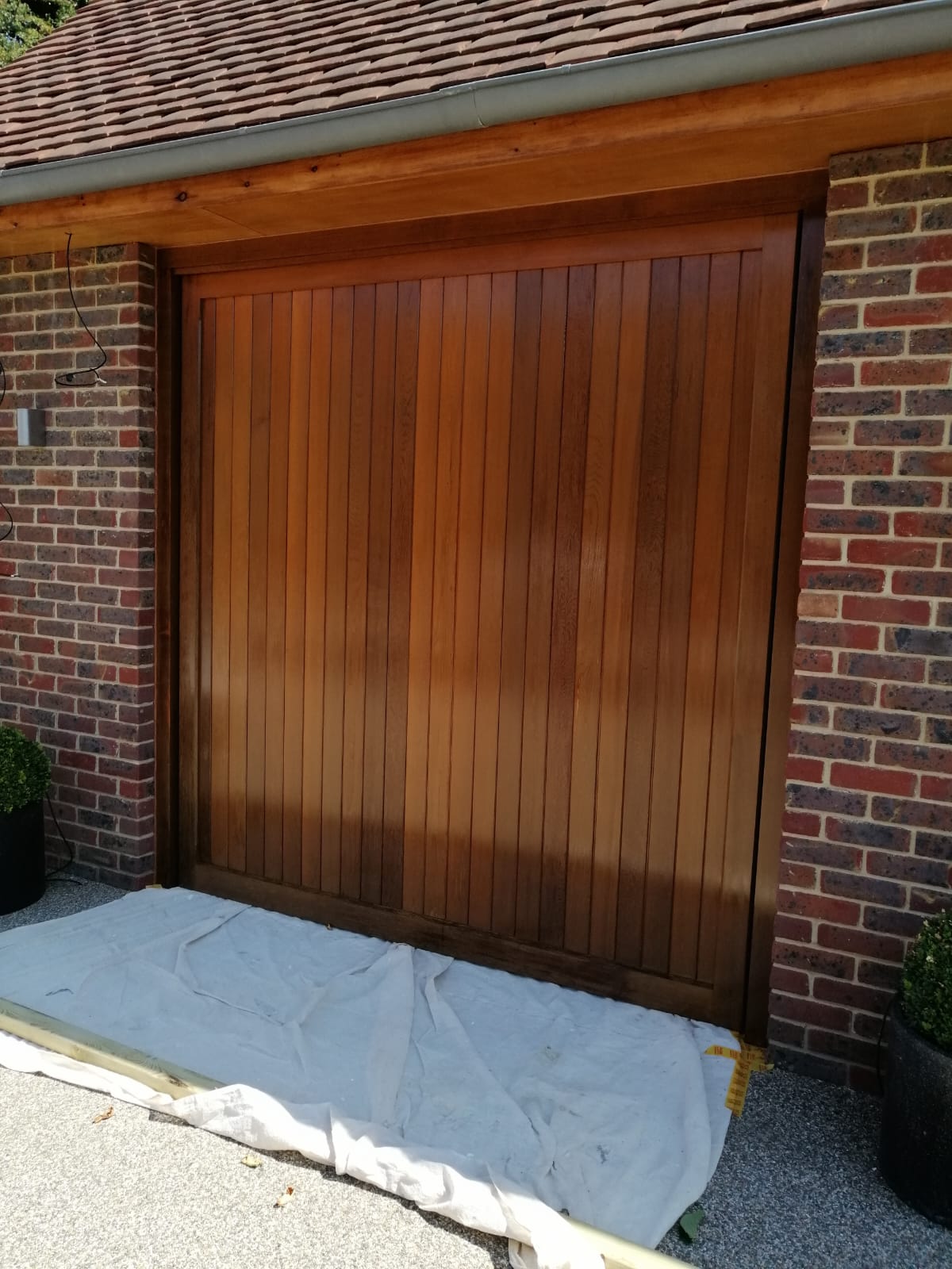 Newly stained wooden garage door