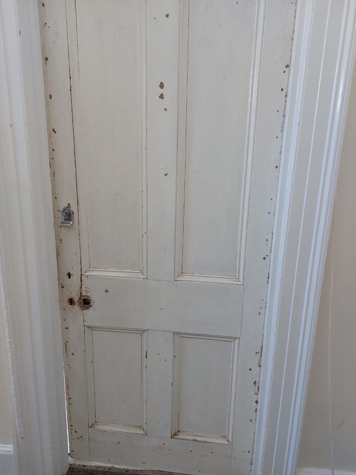 A worn, cracked and scratched door