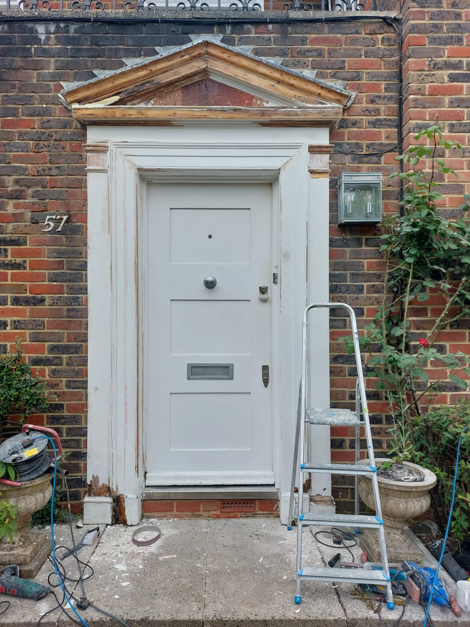 A white door needing some maintenance