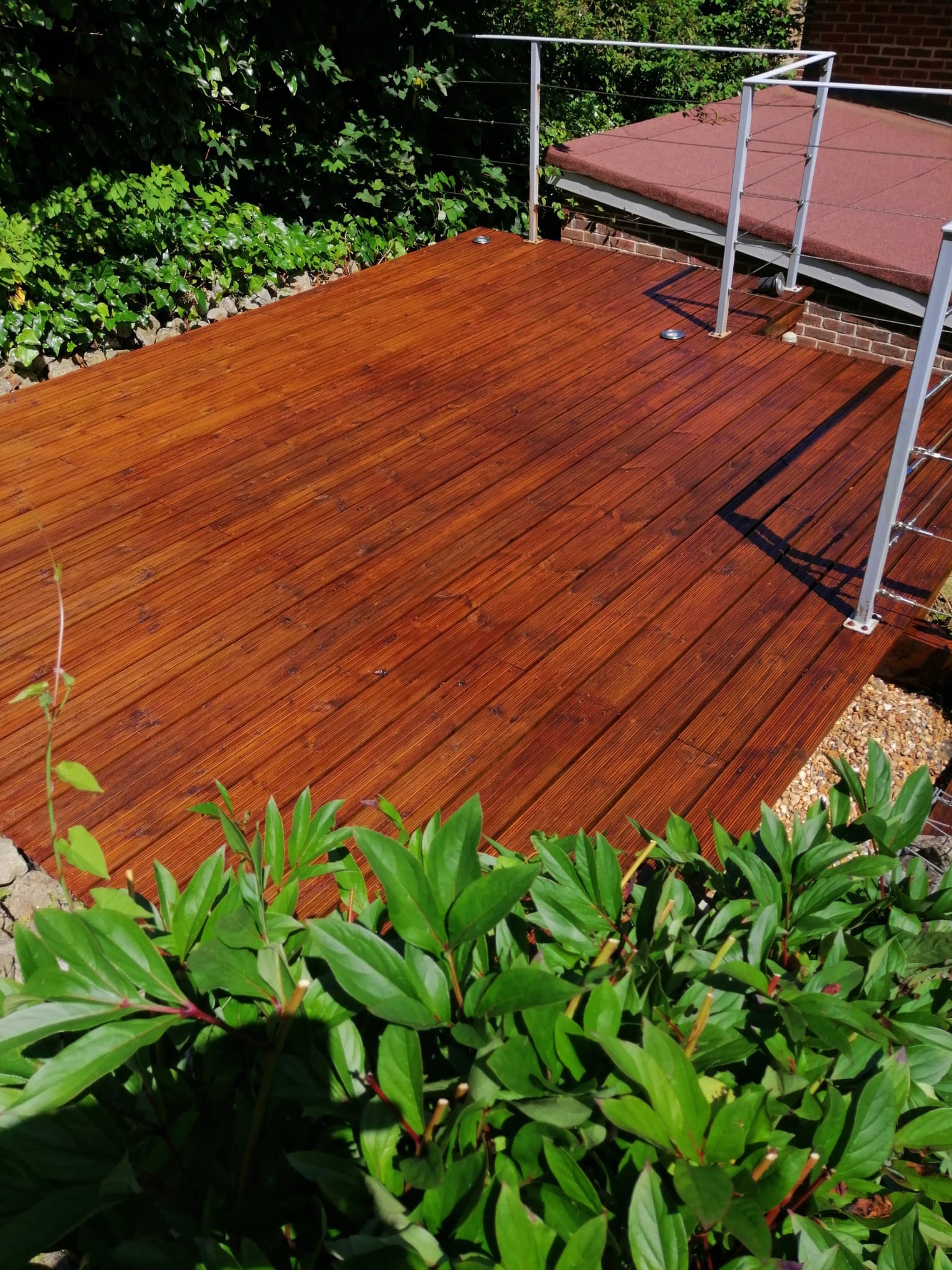 Cleaned wooden deck with staining.